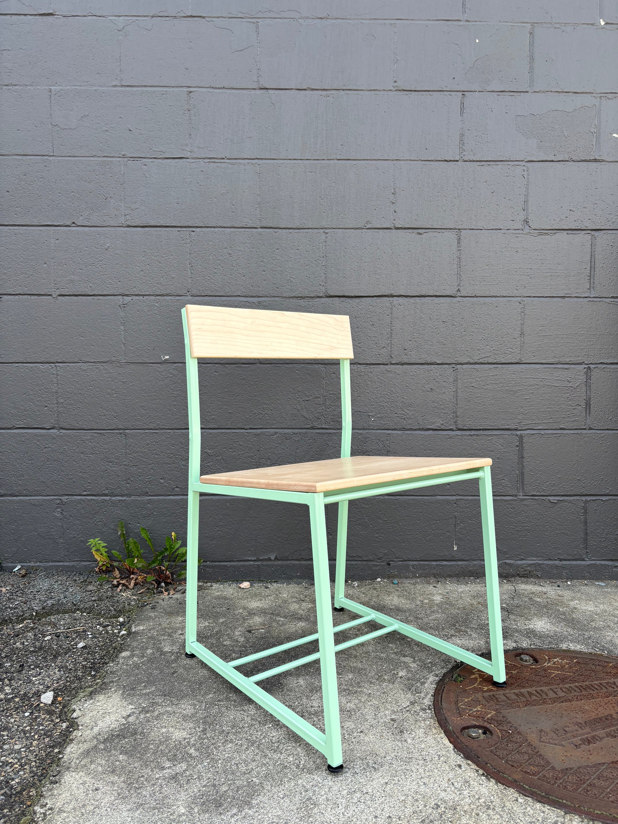 mint green restaurant chair with wood seats