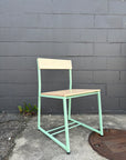 mint green restaurant chair with wood seats